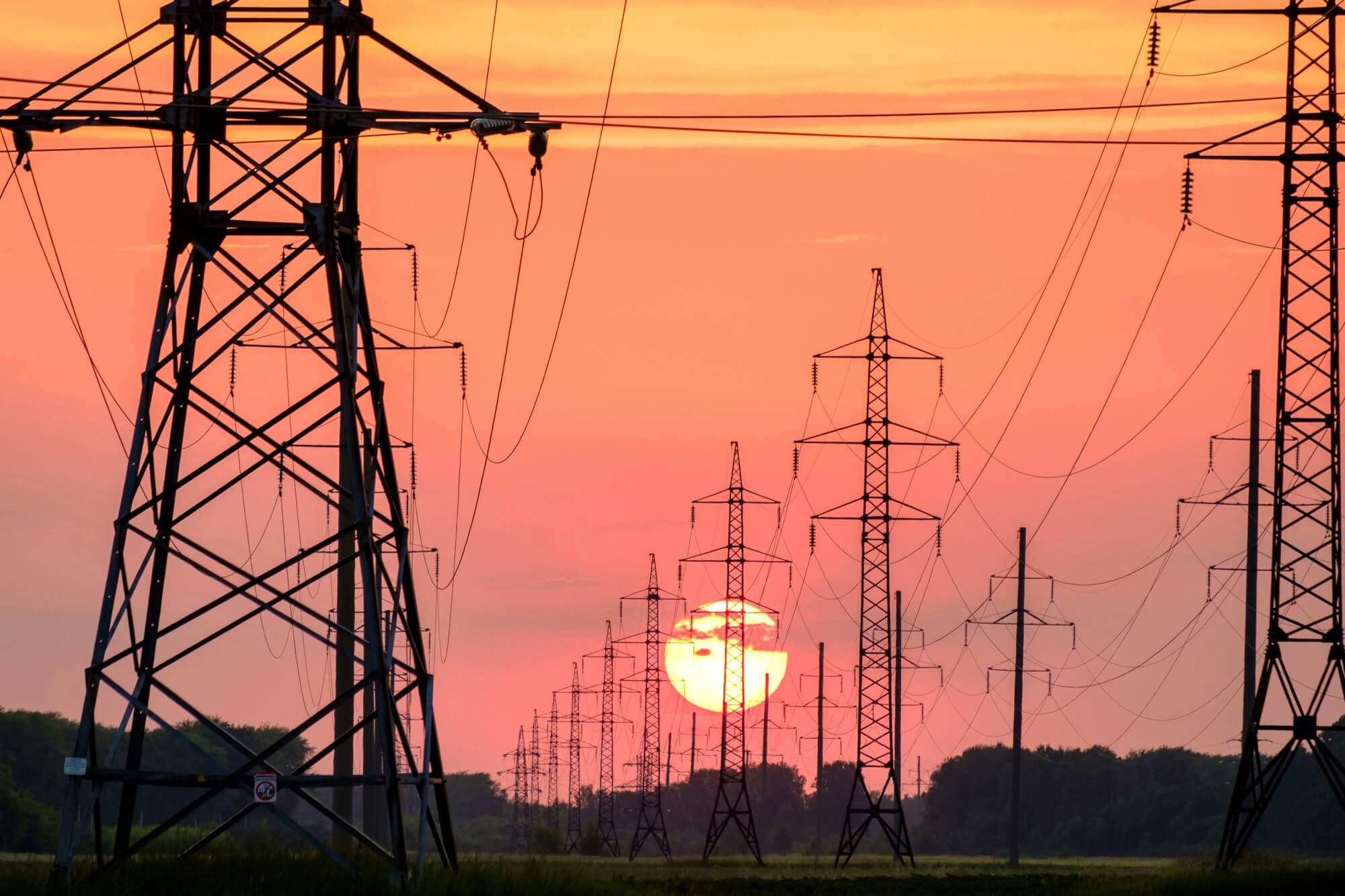 electricity pylons in the sunset